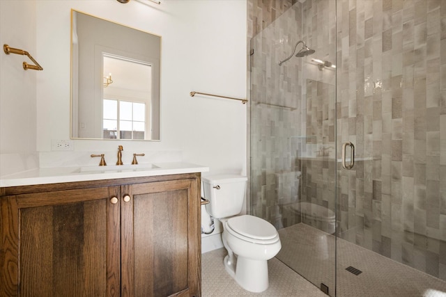 bathroom with tile patterned flooring, vanity, toilet, and an enclosed shower