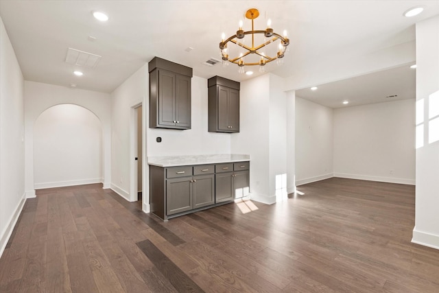 kitchen featuring dark hardwood / wood-style floors and an inviting chandelier