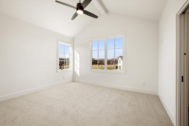 carpeted spare room featuring vaulted ceiling with beams and ceiling fan