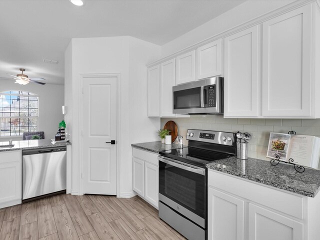 dining space with light hardwood / wood-style flooring