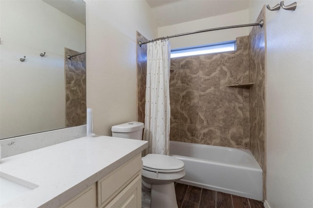 full bathroom with vanity, shower / bath combination with curtain, and toilet