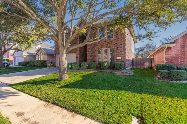 view of front of home with a front yard and a garage