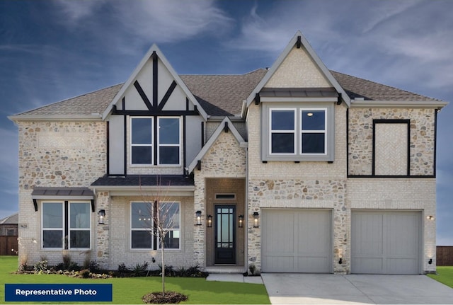 view of front of house featuring a garage and a front lawn