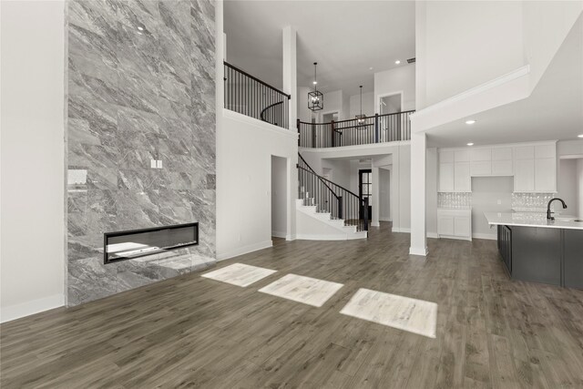 bedroom featuring ceiling fan, a raised ceiling, and light colored carpet