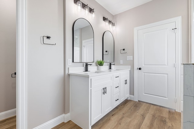 bathroom featuring hardwood / wood-style flooring and vanity