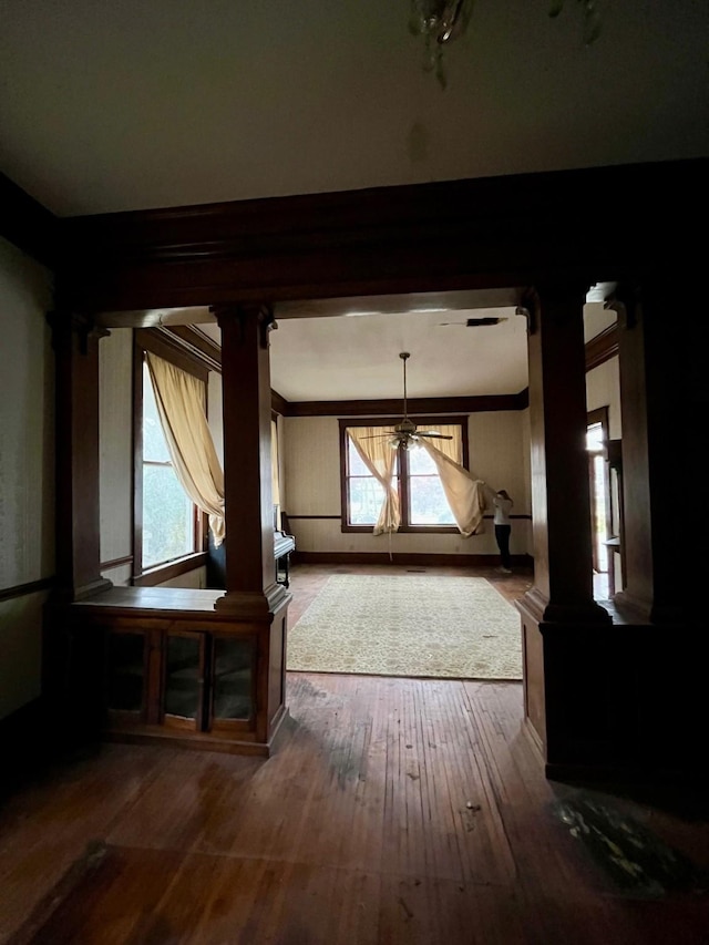 bonus room featuring wood-type flooring and ornate columns