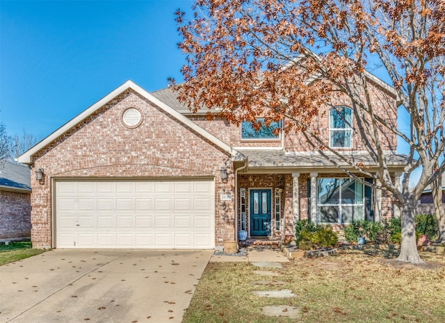 view of front of property with a garage