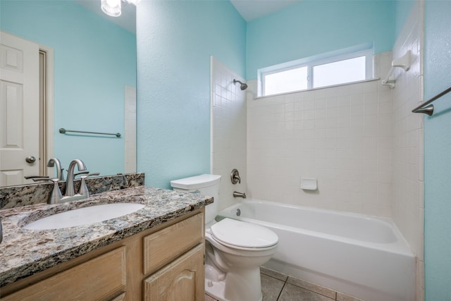 full bathroom with washtub / shower combination, tile patterned flooring, vanity, and toilet