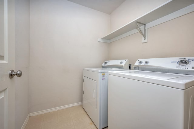 laundry area with washing machine and clothes dryer