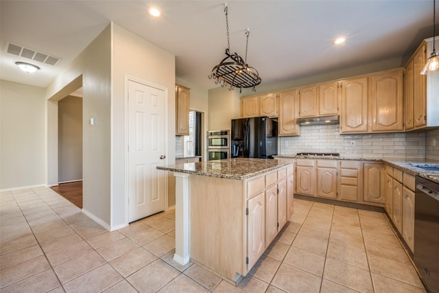 kitchen featuring light tile patterned flooring, backsplash, light stone countertops, appliances with stainless steel finishes, and a kitchen island