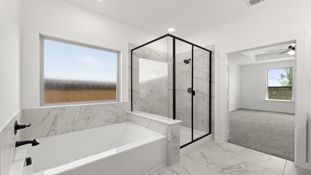 bathroom featuring a bath, a marble finish shower, marble finish floor, visible vents, and a ceiling fan