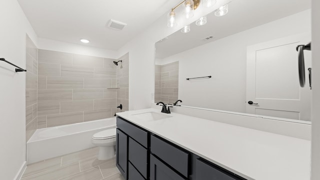 bathroom with visible vents, toilet, vanity, and bathing tub / shower combination