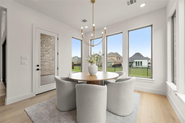 2671 Pelican Pt, Prosper, TX 75078 - dining area with healthy amount of natural light, light wood-style floors, baseboards, and recessed lighting