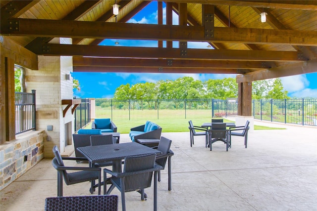 view of patio / terrace with a gazebo and an outdoor stone fireplace