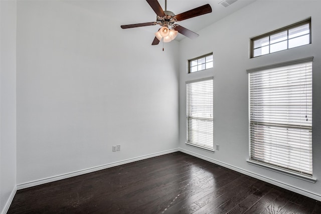 spare room with ceiling fan and dark hardwood / wood-style flooring