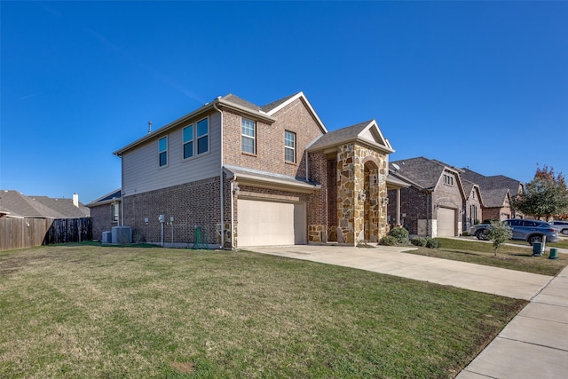 view of front of home with central air condition unit, a front yard, and a garage