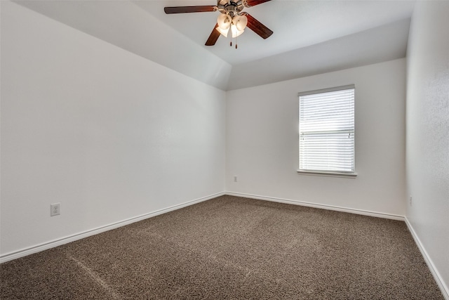 spare room with carpet, vaulted ceiling, and ceiling fan