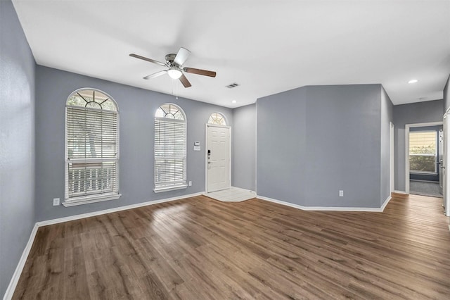 empty room featuring ceiling fan and hardwood / wood-style floors