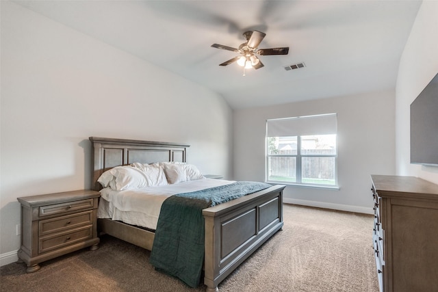 carpeted bedroom with ceiling fan and lofted ceiling