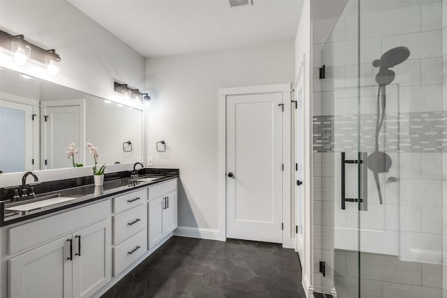 bathroom featuring tile patterned floors, vanity, and an enclosed shower