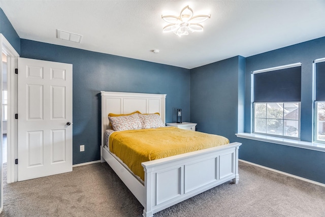 bedroom featuring light colored carpet