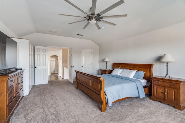 carpeted bedroom featuring ceiling fan and lofted ceiling