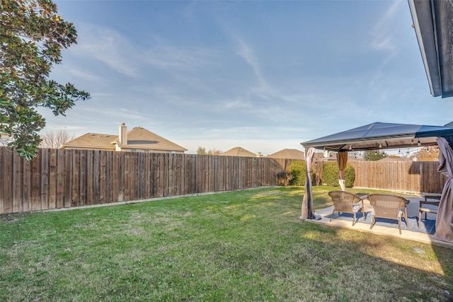 view of yard featuring a gazebo and a patio area