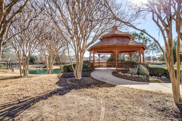 view of community with a gazebo and a water view