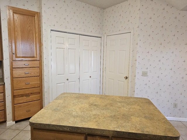 bedroom featuring a closet and light tile patterned flooring