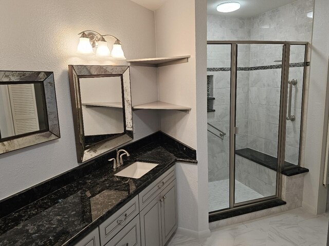 bathroom with vanity and an enclosed shower