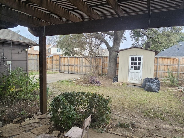 view of yard featuring a pergola and a shed