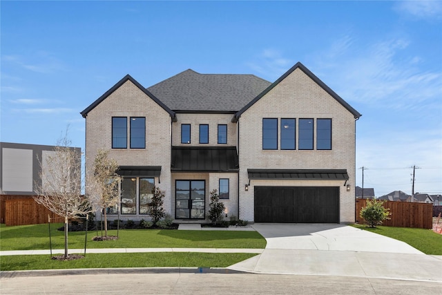 view of front of house with brick siding, concrete driveway, a front yard, fence, and a garage