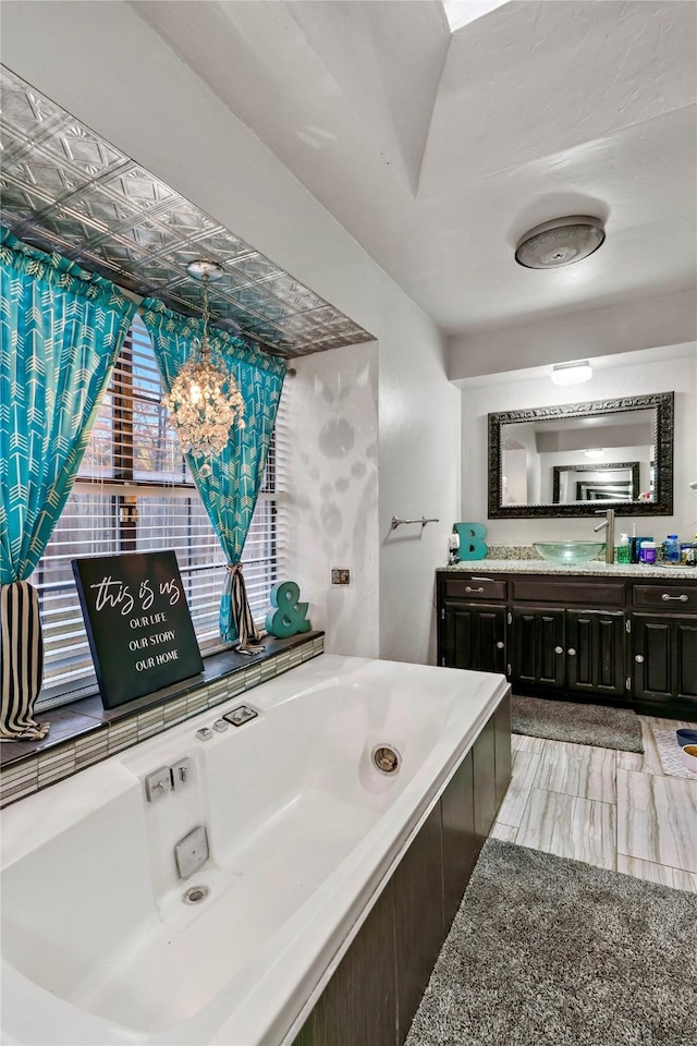 full bathroom with a bath and vanity