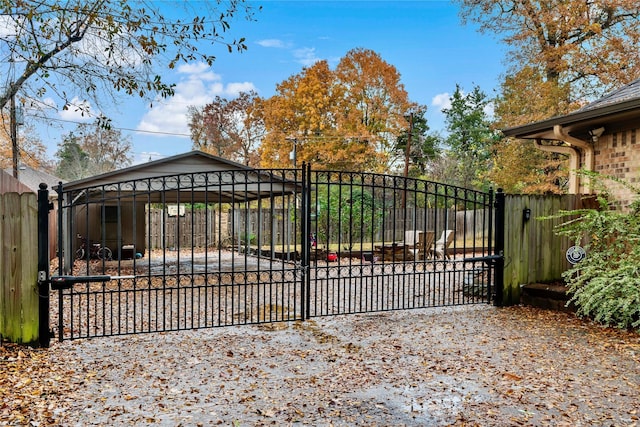 view of gate featuring fence