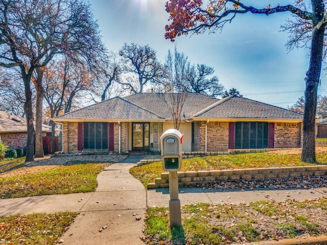 single story home with a front yard