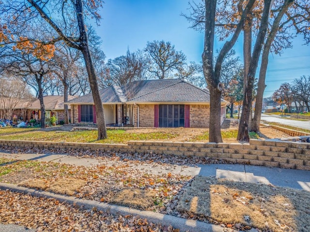 single story home featuring a front yard