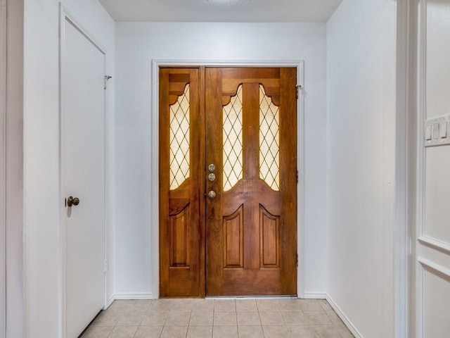 entrance foyer featuring light tile patterned flooring