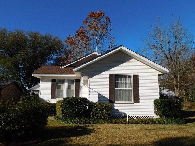 view of property exterior featuring a yard