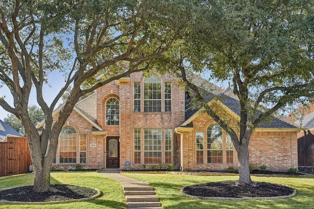 front facade with a front yard