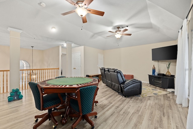 game room with ceiling fan, light wood-type flooring, and decorative columns