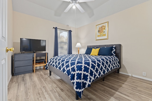 bedroom featuring hardwood / wood-style floors and ceiling fan