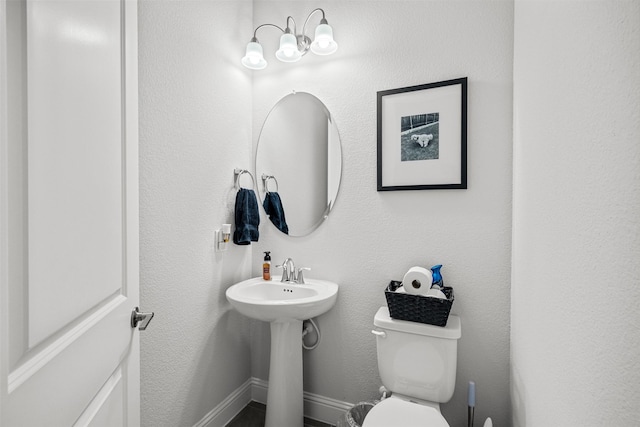 bathroom with toilet and sink