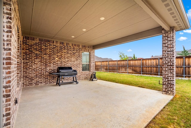 view of patio with a grill