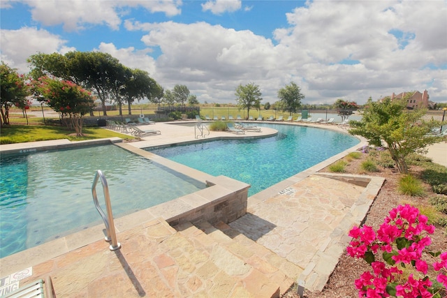 view of swimming pool featuring a patio area