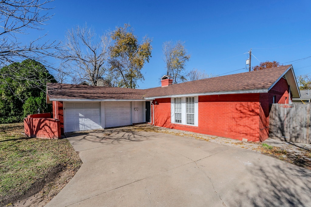 ranch-style home with a garage