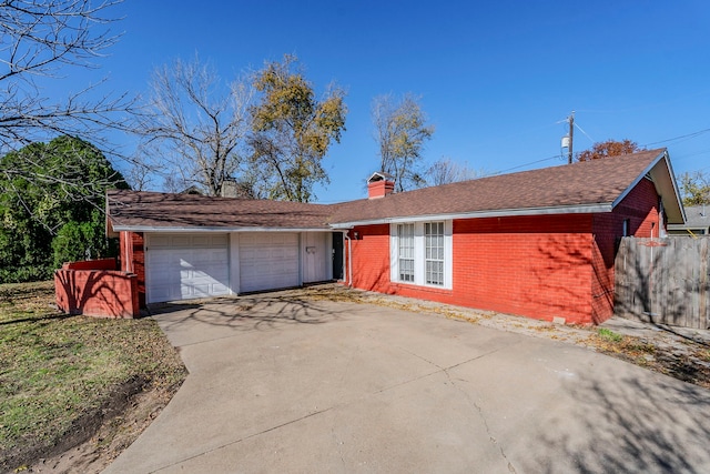 single story home featuring a garage