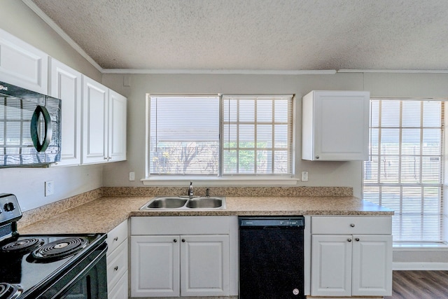 kitchen featuring sink, crown molding, wood-type flooring, white cabinets, and black appliances