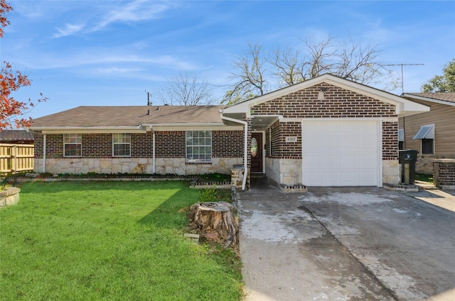 ranch-style home with a front yard and a garage