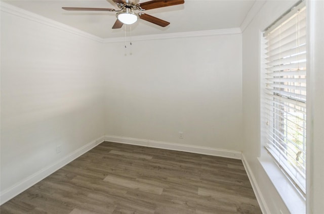 unfurnished room featuring ornamental molding, ceiling fan, baseboards, and dark wood-style floors