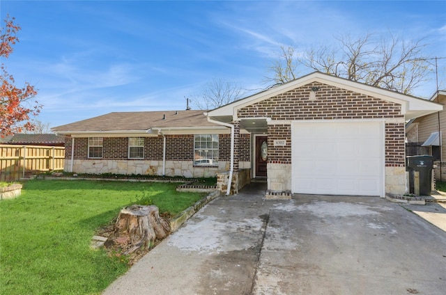 single story home featuring a garage and a front lawn